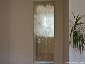 Colourless art glass wall with the floral motif